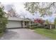 Charming front exterior with brick walkway, a well-kept lawn, and a convenient attached two-car garage at 8903 Maple Hill Dr, Indianapolis, IN 46239