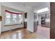Kitchen featuring brick floors, dark wood cabinets, window, and skylight at 8903 Maple Hill Dr, Indianapolis, IN 46239