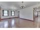 Bright living room with hardwood floors and vintage chandeliers at 8903 Maple Hill Dr, Indianapolis, IN 46239