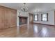 Bright living room with hardwood floors, fireplace and vintage chandeliers at 8903 Maple Hill Dr, Indianapolis, IN 46239