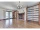 Bright living room featuring hardwood floors, fireplace and built-in shelving at 8903 Maple Hill Dr, Indianapolis, IN 46239