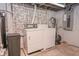 Laundry area in basement featuring vintage washer and dryer and utility hookups at 8944 W 21St St, Indianapolis, IN 46234