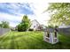 Large backyard featuring a playhouse and swing set, perfect for outdoor fun and entertaining at 8970 Buttercup Ct, Noblesville, IN 46060
