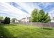 Spacious backyard featuring a well-maintained lawn and a wooden fence, great for outdoor activities and relaxation at 8970 Buttercup Ct, Noblesville, IN 46060