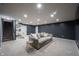 Spacious finished basement with a plush couch, neutral carpeting, and recessed lighting at 8970 Buttercup Ct, Noblesville, IN 46060