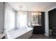 Bright bathroom featuring a soaking tub, gray walls, chandelier, and dark vanity at 8970 Buttercup Ct, Noblesville, IN 46060