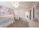 Inviting bedroom with floral wallpaper, a bunk bed with a slide, and access to another room at 8970 Buttercup Ct, Noblesville, IN 46060