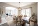 The formal dining room connects to the living room and showcases a view of the piano room at 8970 Buttercup Ct, Noblesville, IN 46060