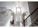 Stunning foyer with soaring ceilings, decorative lighting, and elegant staircase create an inviting entrance at 8970 Buttercup Ct, Noblesville, IN 46060
