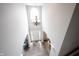Bright and airy foyer featuring high ceilings, hardwood floors, and a modern chandelier at 8970 Buttercup Ct, Noblesville, IN 46060