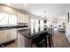Modern kitchen flows into the living room and boasts stainless steel appliances and hardwood floors at 8970 Buttercup Ct, Noblesville, IN 46060