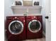 Modern laundry room featuring front loading washer and dryer set and shelf with decorative baskets at 8970 Buttercup Ct, Noblesville, IN 46060