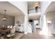Bright and airy living room with a view of an upstairs landing and an open floor plan at 8970 Buttercup Ct, Noblesville, IN 46060