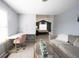 Open living room featuring a view to the office area and main bedroom with ensuite bath at 8970 Buttercup Ct, Noblesville, IN 46060