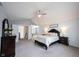 Bright main bedroom with vaulted ceilings, neutral carpet, dresser and ensuite bath access at 8970 Buttercup Ct, Noblesville, IN 46060