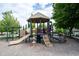 Community playground featuring slides and climbing structures, providing a fun and safe play area for children at 8970 Buttercup Ct, Noblesville, IN 46060