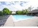 Large community pool with lounge chairs and shaded pavilion, perfect for summer relaxation and recreation at 8970 Buttercup Ct, Noblesville, IN 46060