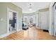 Bright flex room with hardwood floors, lots of light, and adjacent to a bathroom at 925 S State Ave, Indianapolis, IN 46203