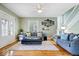 Inviting living room with hardwood floors, modern decor, and plenty of natural light at 925 S State Ave, Indianapolis, IN 46203
