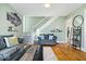 Spacious living room with hardwood floors, modern decor, and easy access to other rooms at 925 S State Ave, Indianapolis, IN 46203