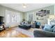 Cozy living room with hardwood floors, modern decor, and plenty of space for relaxing at 925 S State Ave, Indianapolis, IN 46203
