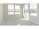 Sunlit bedroom featuring carpet, large windows, and neutral paint, offering comfort and style at 9767 Behner Dr, Fishers, IN 46250