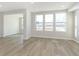 Spacious living room with large windows and hardwood floors, providing ample natural light at 9767 Behner Dr, Fishers, IN 46250