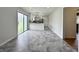 Open floor plan featuring a renovated kitchen with an island and access to dining area at 100 Lincoln St, Plainfield, IN 46168