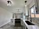 Modern kitchen showcasing sleek countertops, stainless steel appliances, and contemporary lighting at 100 Lincoln St, Plainfield, IN 46168