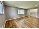 Spacious living room with hardwood floors and natural light, freshly painted and ready for new occupants at 100 Lincoln St, Plainfield, IN 46168