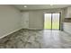 Bright sun room featuring tile flooring and sliding glass doors, perfect for relaxation at 100 Lincoln St, Plainfield, IN 46168