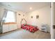 Well-lit bedroom featuring a playful decor, a cozy bed, and ample storage space at 10107 Camp Creek Way, Indianapolis, IN 46229