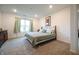 Comfortable bedroom featuring a wrought iron bed frame, soft colors, and natural light at 10107 Camp Creek Way, Indianapolis, IN 46229