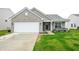 Charming single-story home with a two-car garage and inviting front porch at 10107 Camp Creek Way, Indianapolis, IN 46229