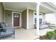 Cozy front porch with comfortable seating, stylish decor, and welcoming entrance at 10107 Camp Creek Way, Indianapolis, IN 46229