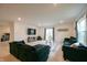 Spacious living room with neutral walls, a large sectional sofa, and natural light at 10107 Camp Creek Way, Indianapolis, IN 46229
