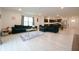 Inviting living space with modern kitchen, dining area, and comfortable sectional sofa at 10107 Camp Creek Way, Indianapolis, IN 46229