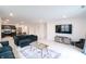 Open-concept living space with a modern kitchen, cozy seating, and stylish decor at 10107 Camp Creek Way, Indianapolis, IN 46229
