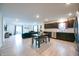 Open-concept living space with modern kitchen, dining area, and comfortable seating at 10107 Camp Creek Way, Indianapolis, IN 46229