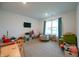 Bright playroom featuring carpeted floors, natural light, and ample space for play and storage at 10107 Camp Creek Way, Indianapolis, IN 46229