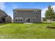 Expansive backyard featuring a lawn with a patio and lush green grass at 10126 Redwood Peak Ln, Indianapolis, IN 46259