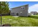 Home featuring backyard with patio and an expansive lawn at 10126 Redwood Peak Ln, Indianapolis, IN 46259