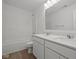 Bright bathroom featuring double sinks with stone countertops and white cabinetry at 10126 Redwood Peak Ln, Indianapolis, IN 46259