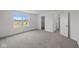 Bedroom features carpet floors, a bright window, a closet, and a neutral color palette at 10126 Redwood Peak Ln, Indianapolis, IN 46259