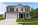 Charming two-story home with attached two car garage and well-manicured lawn at 10126 Redwood Peak Ln, Indianapolis, IN 46259