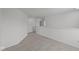 Neutral hallway featuring soft carpet and views of doorways to other rooms at 10126 Redwood Peak Ln, Indianapolis, IN 46259