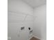 Neat laundry room with connection points and wire shelving ready for appliances at 10126 Redwood Peak Ln, Indianapolis, IN 46259
