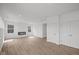 Open living room with modern fireplace, large windows and stylish floors at 10126 Redwood Peak Ln, Indianapolis, IN 46259