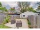 Spacious backyard featuring a patio, seating, and wooden fence, ideal for outdoor gatherings at 1021 Harlan St, Indianapolis, IN 46203
