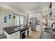 Contemporary kitchen featuring an island cooktop, stainless steel appliances, and sleek countertops for culinary enthusiasts at 1021 Harlan St, Indianapolis, IN 46203